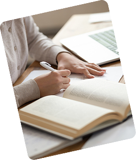 Graduate student holding a book