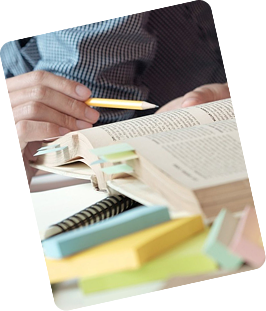 Graduate student holding a book